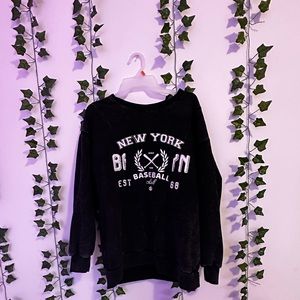 Black crewneck, white text, size medium from forever 21.